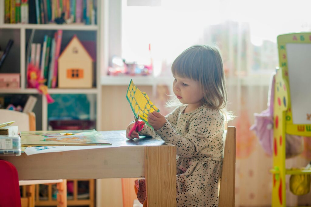 child cutting paper