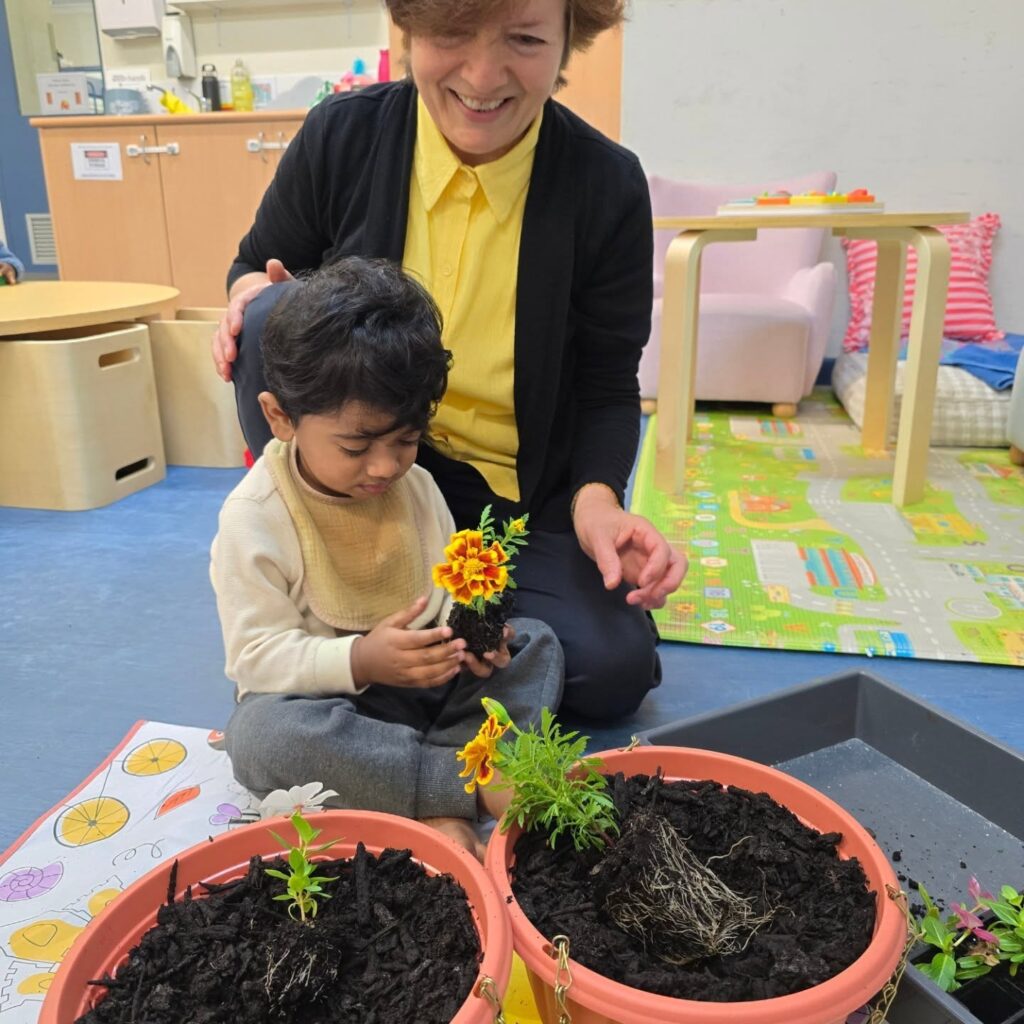 Daisy's Childcare Southern River flower activity with educator